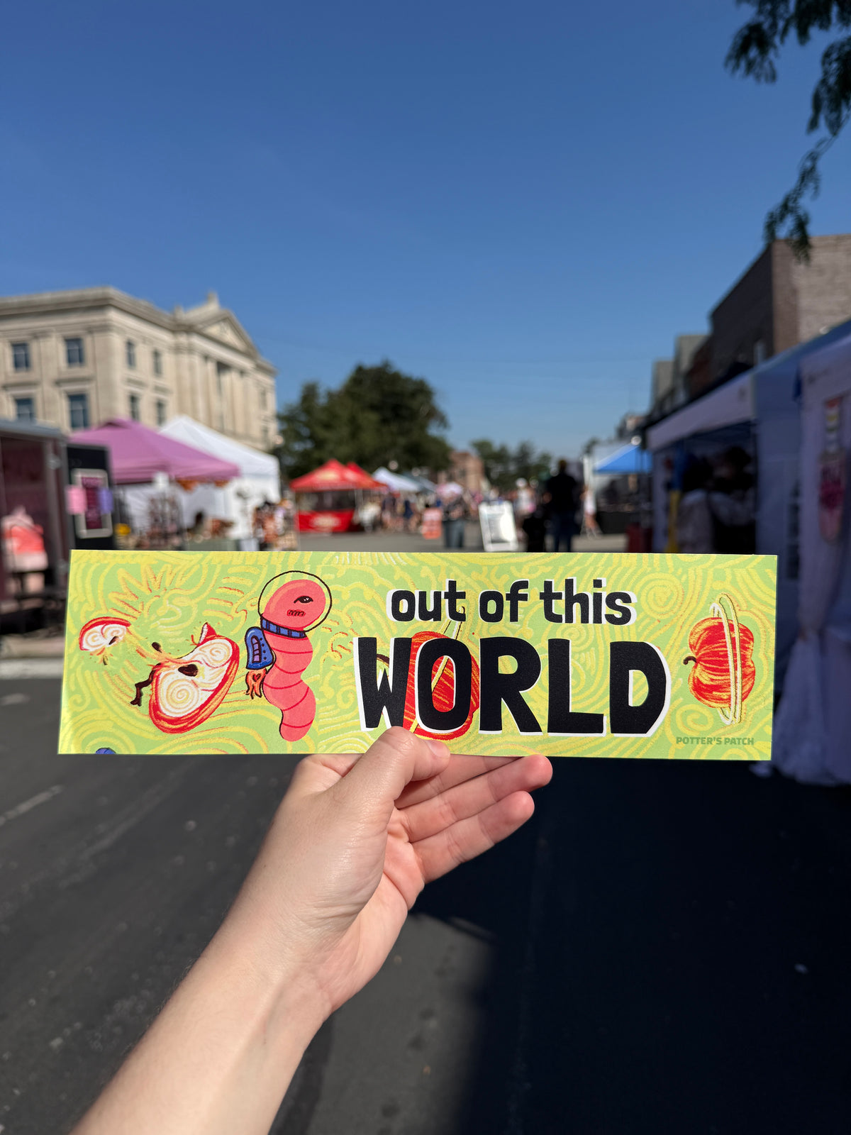 Out of This World Astronaut Worm and Apple planets Bumper Sticker | whimsical space design