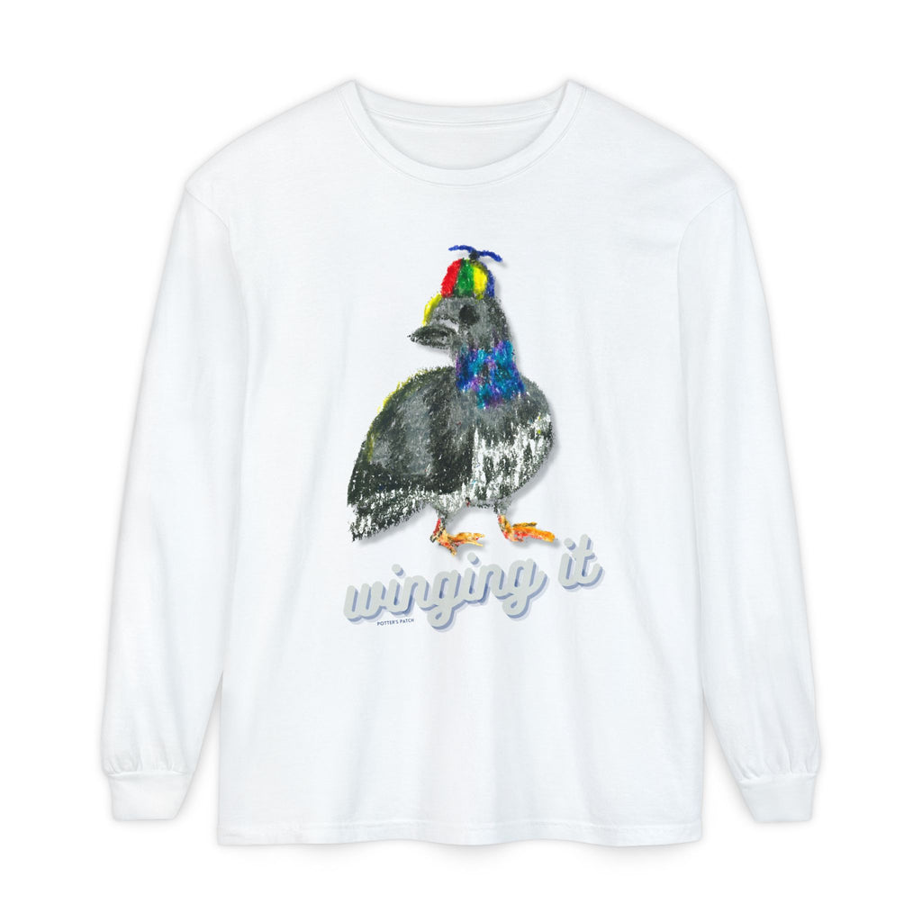 White long sleeve tee with a whimsical hand-illustrated pigeon wearing a colorful pinwheel hat, with the text "winging it" printed below in a retro script font. 